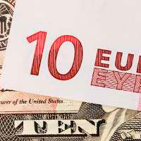 Dollar slides on Chinese data, euro awaits inflation numbers